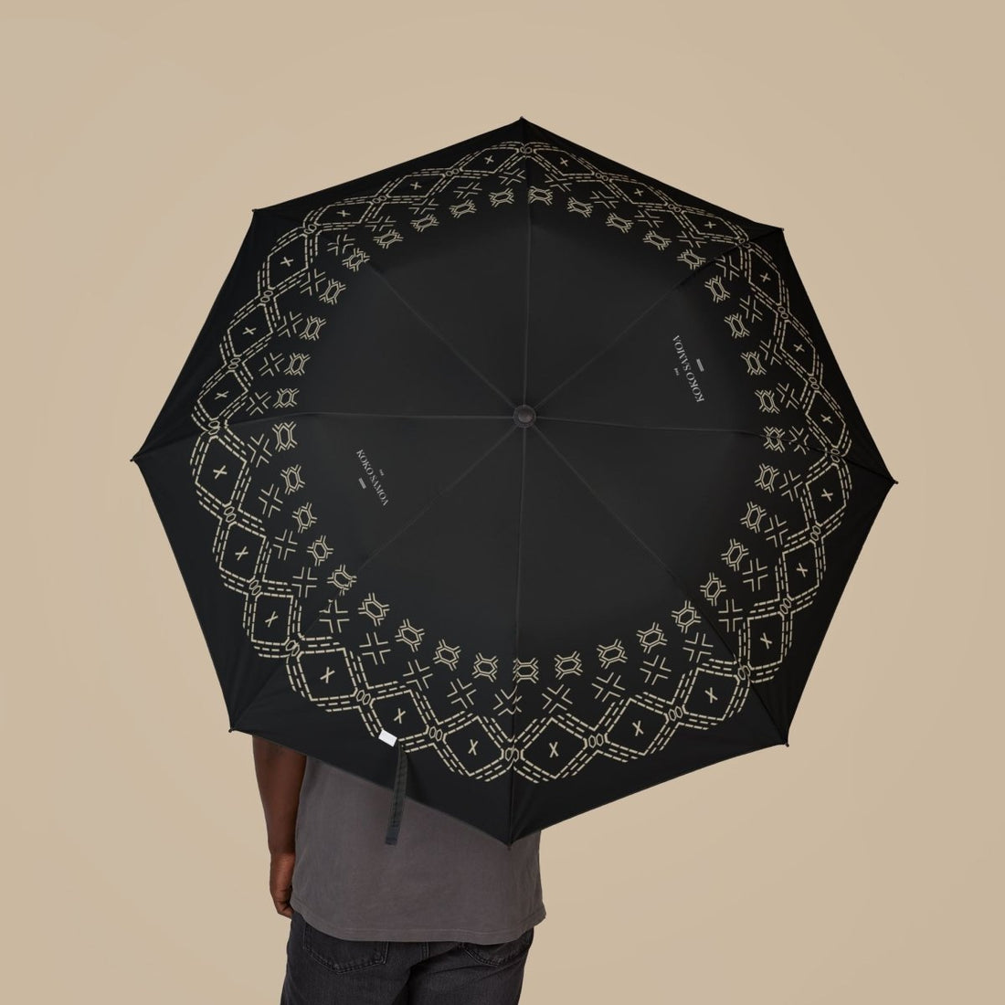 PasifikaOne umbrella, 48-inch Malu design, waterproof accessory with vibrant Polynesian-inspired pattern, ideal for rain protection.