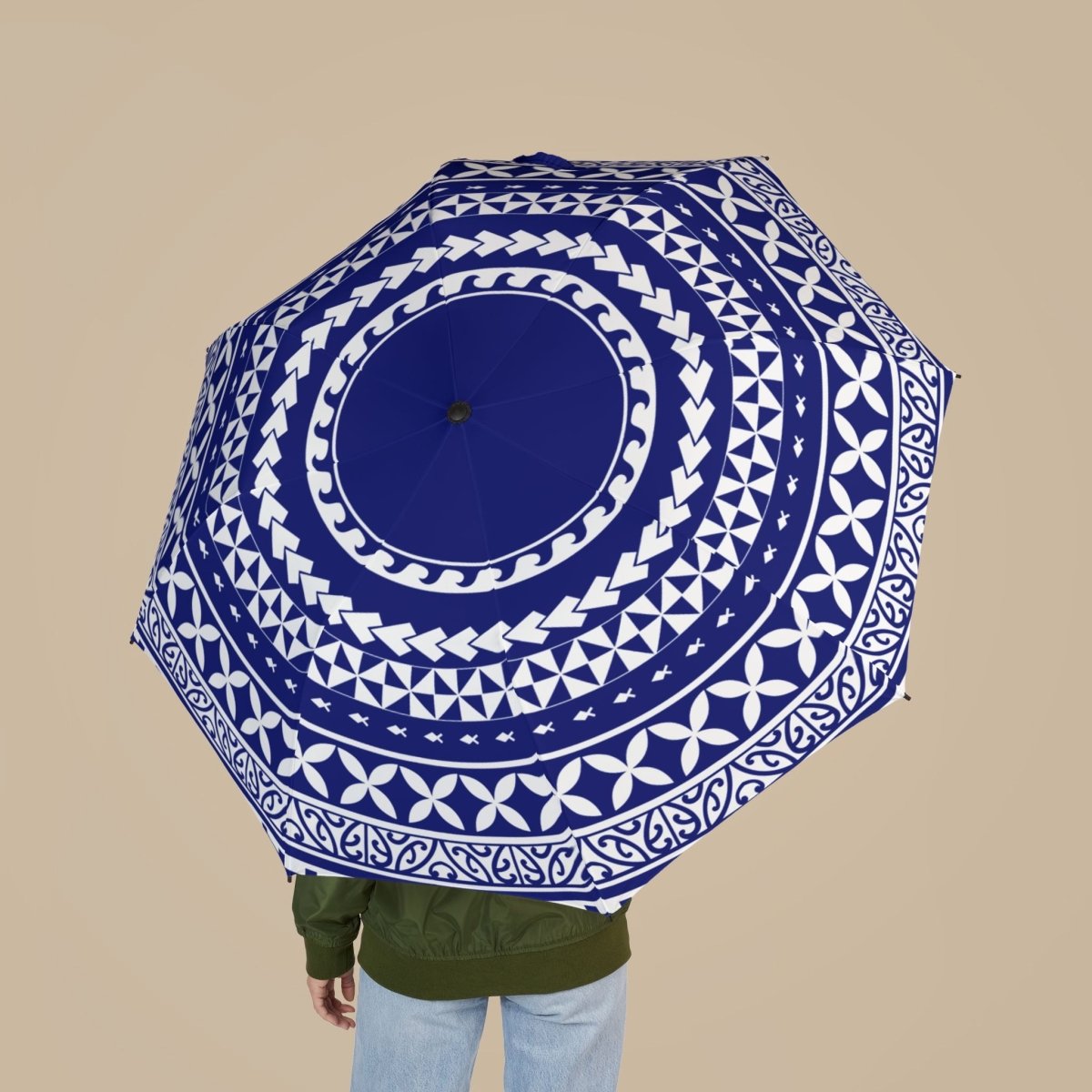 PasifikaOne umbrella, 48-inch wide, in vibrant United Blue with intricate Polynesian-inspired patterns, perfect for rain or sun.