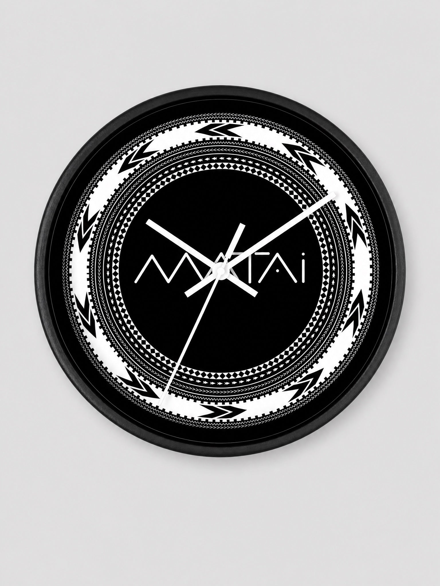 Wall Clock 10"/25cm - Matai on a light grey studio background