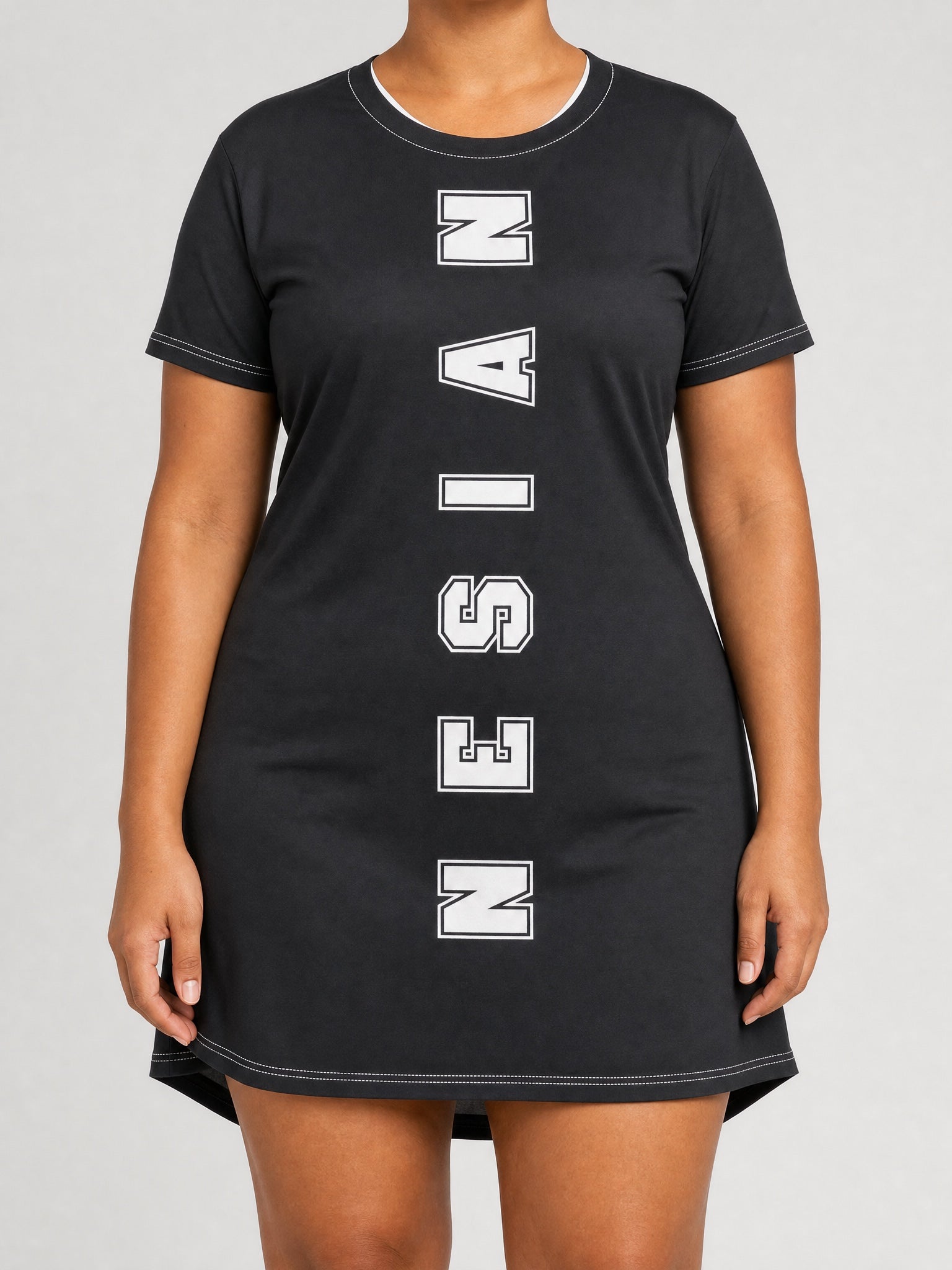 T-Shirt Dress - Nesian Strength on a light grey studio background
