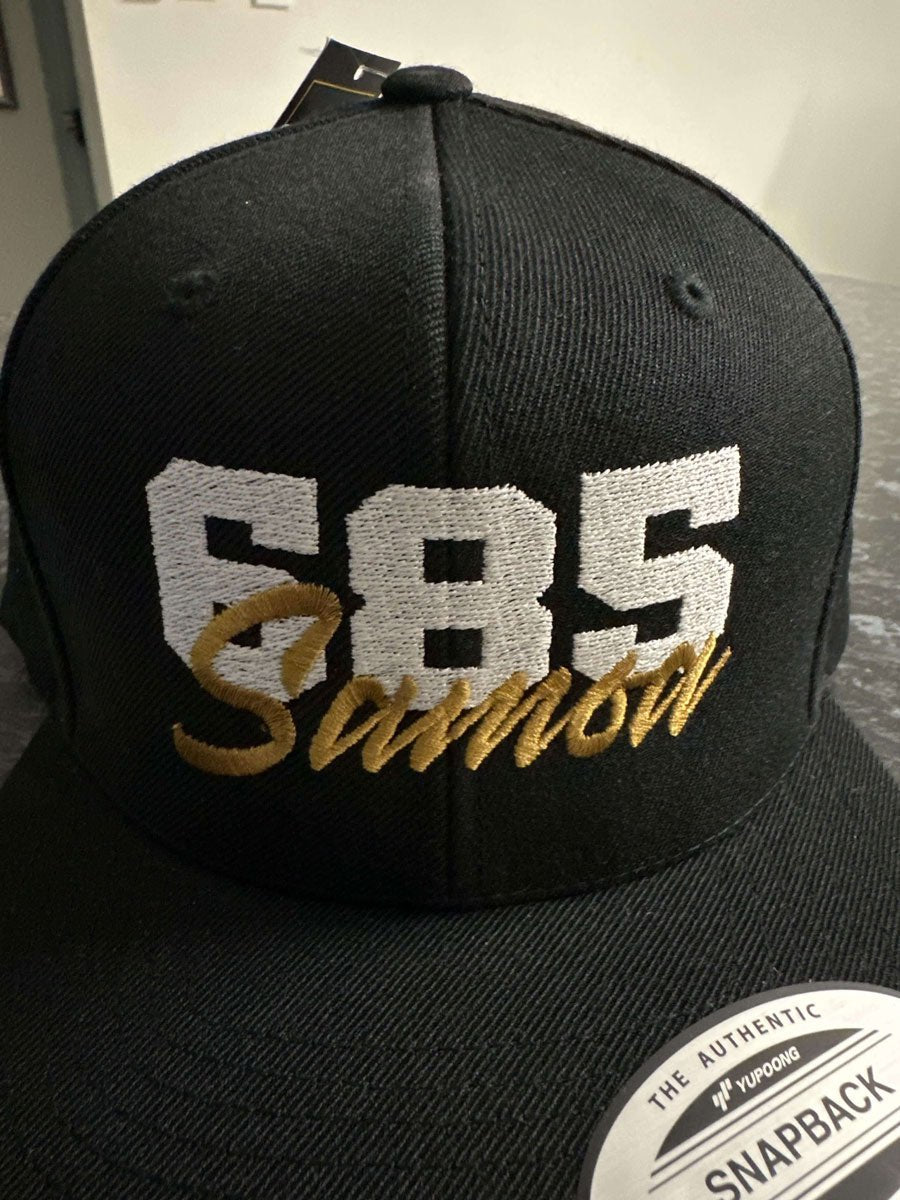 Fulfill Engine flat bill snapback hat in black with white and gold Samoa embroidery, one size, popular in AU, NZ, and USA.