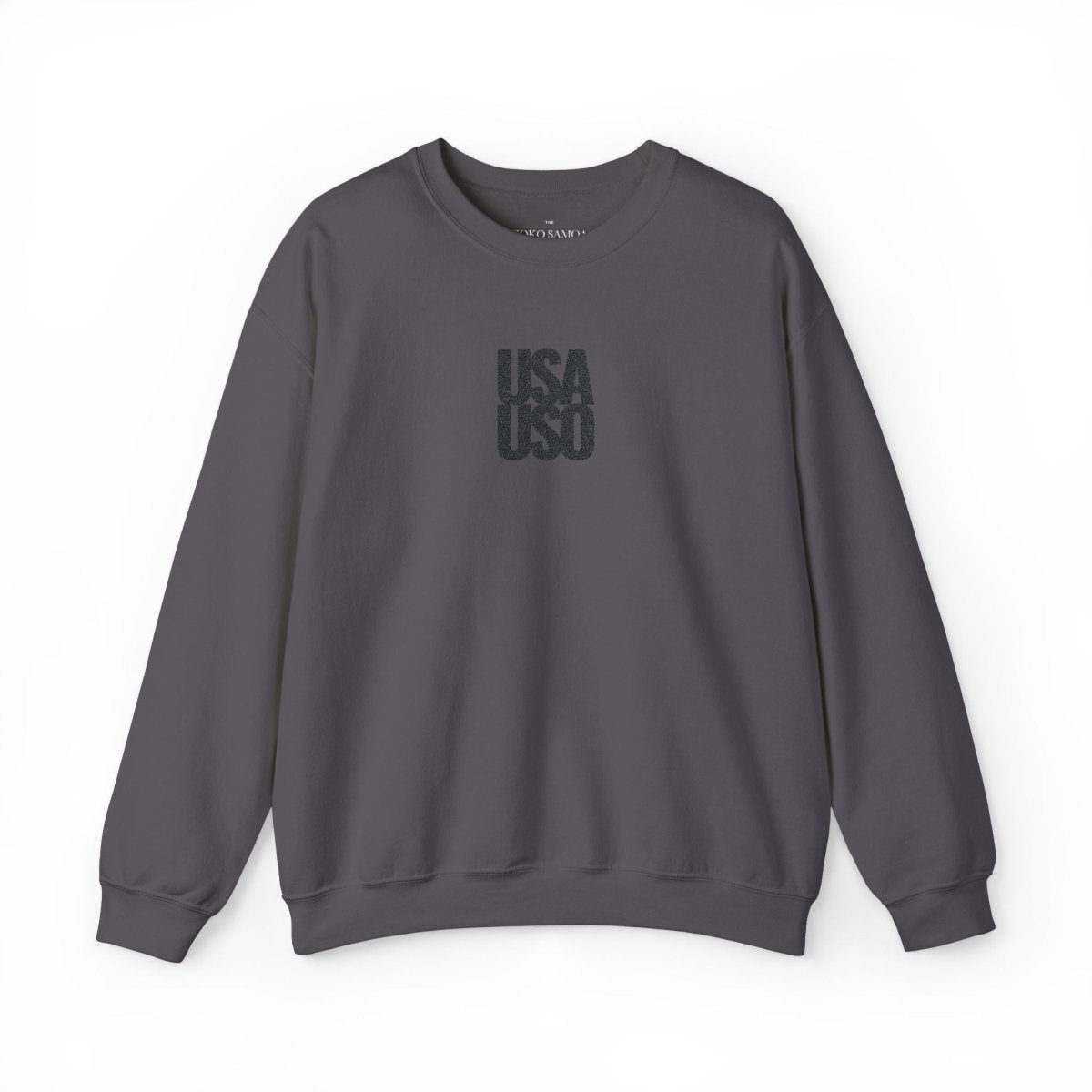 Black embroidered Fulfill Engine unisex heavy sweatshirt with USA USO design, worn by a person, showcasing casual, comfortable style.