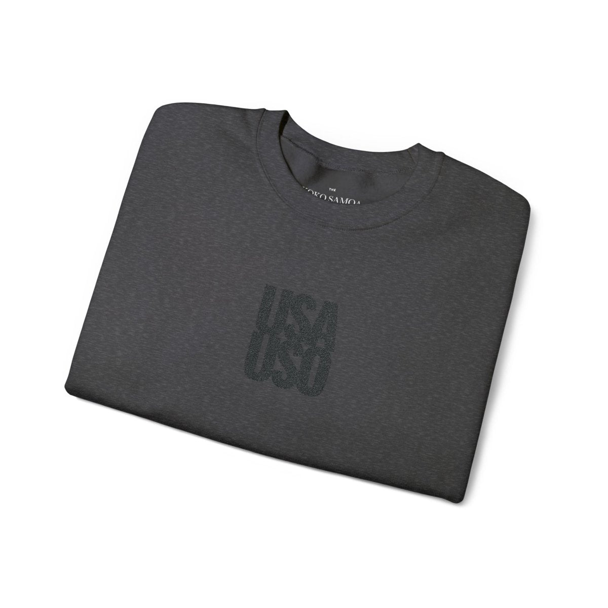 Black embroidered unisex heavy sweatshirt by Fulfill Engine featuring USA USO design, shown on a model.