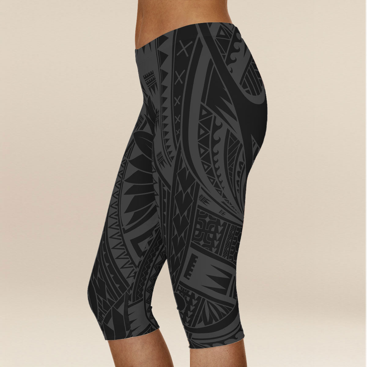 Black FYBY Islandflex Capri Leggings with Warrior design, fitted and stretchy for active wear, shown on a model.