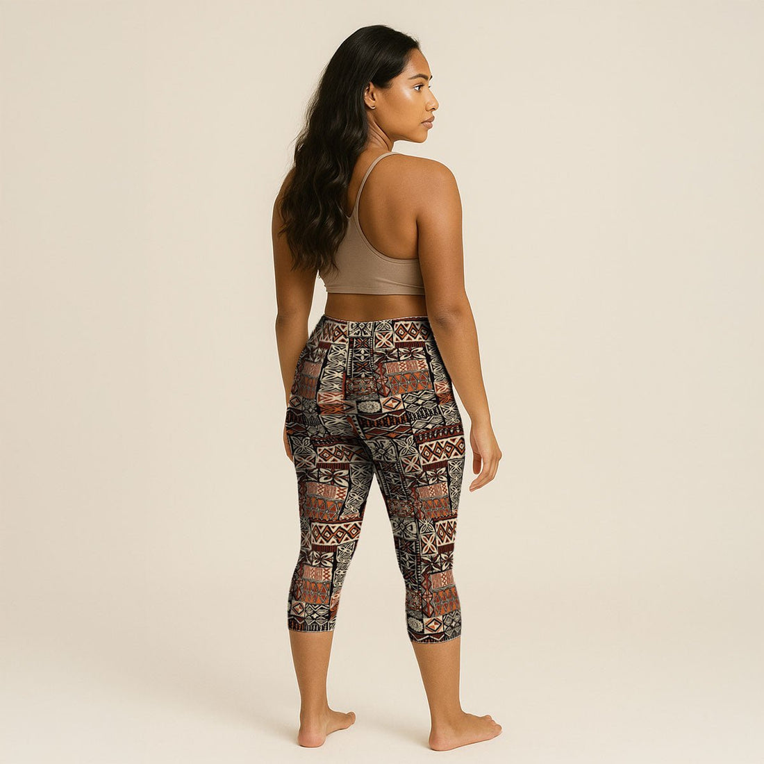 Brown Islandflex Capri Leggings by FYBY, made from Elei fabric, shown in XS size on a model.