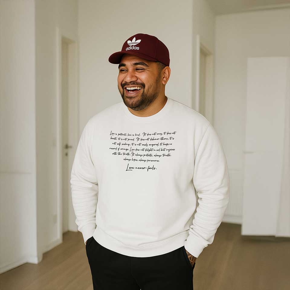 Black Champion unisex sweatshirt by Inkblot with "Love Never Fails" text, casual style, suitable for AU, NZ, and USA.