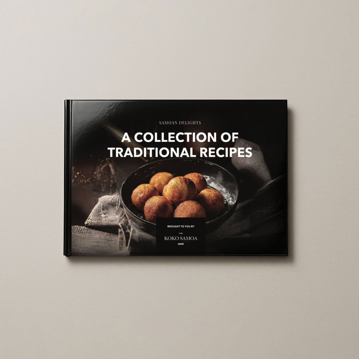 Hardcover cookbook titled Samoan Delights with 24 authentic Samoan recipes, featuring vibrant cover design and Lulu Direct branding