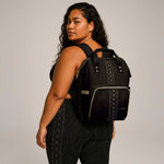 Malu multipurpose diaper bag in stylish design, featuring multiple compartments and durable fabric for parents on the go.