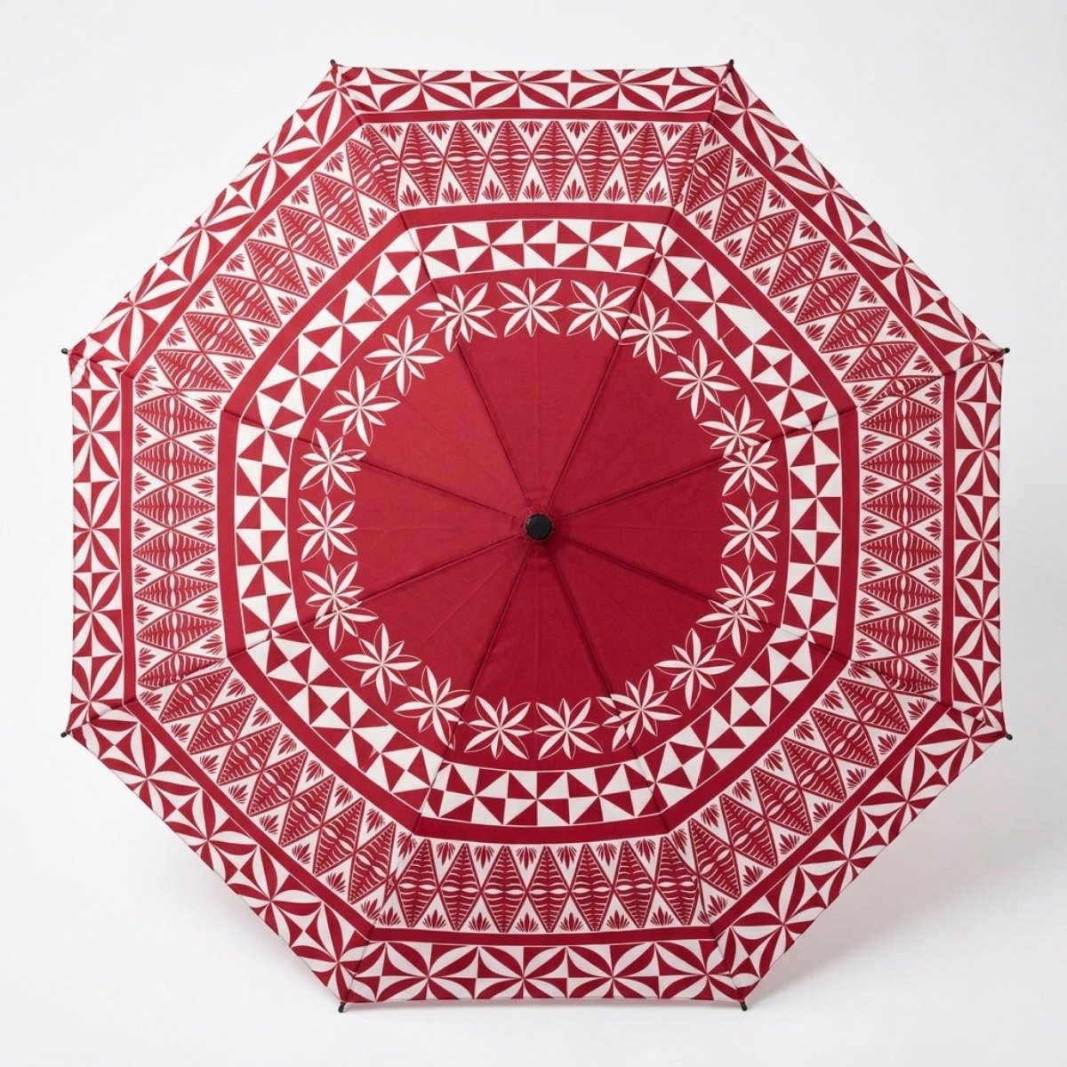Tongan PasifikaOne umbrella, 48-inch, with traditional Polynesian design, featuring vibrant patterns and branding.