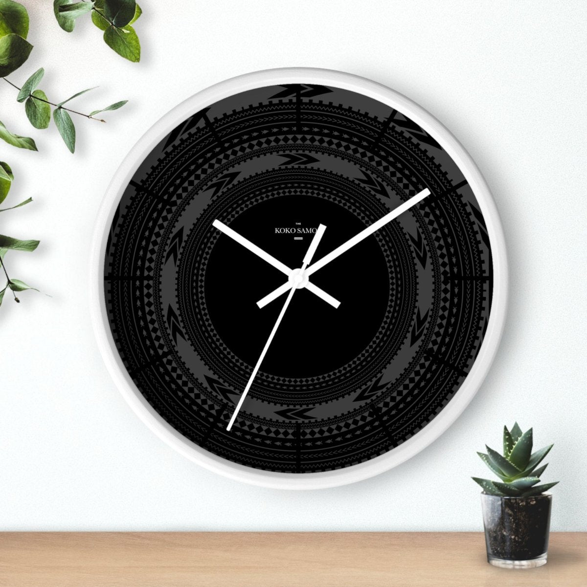 Black 10-inch Wall Clock featuring a sleek black Pe'a design, perfect for modern home decor in AU, NZ, and USA.