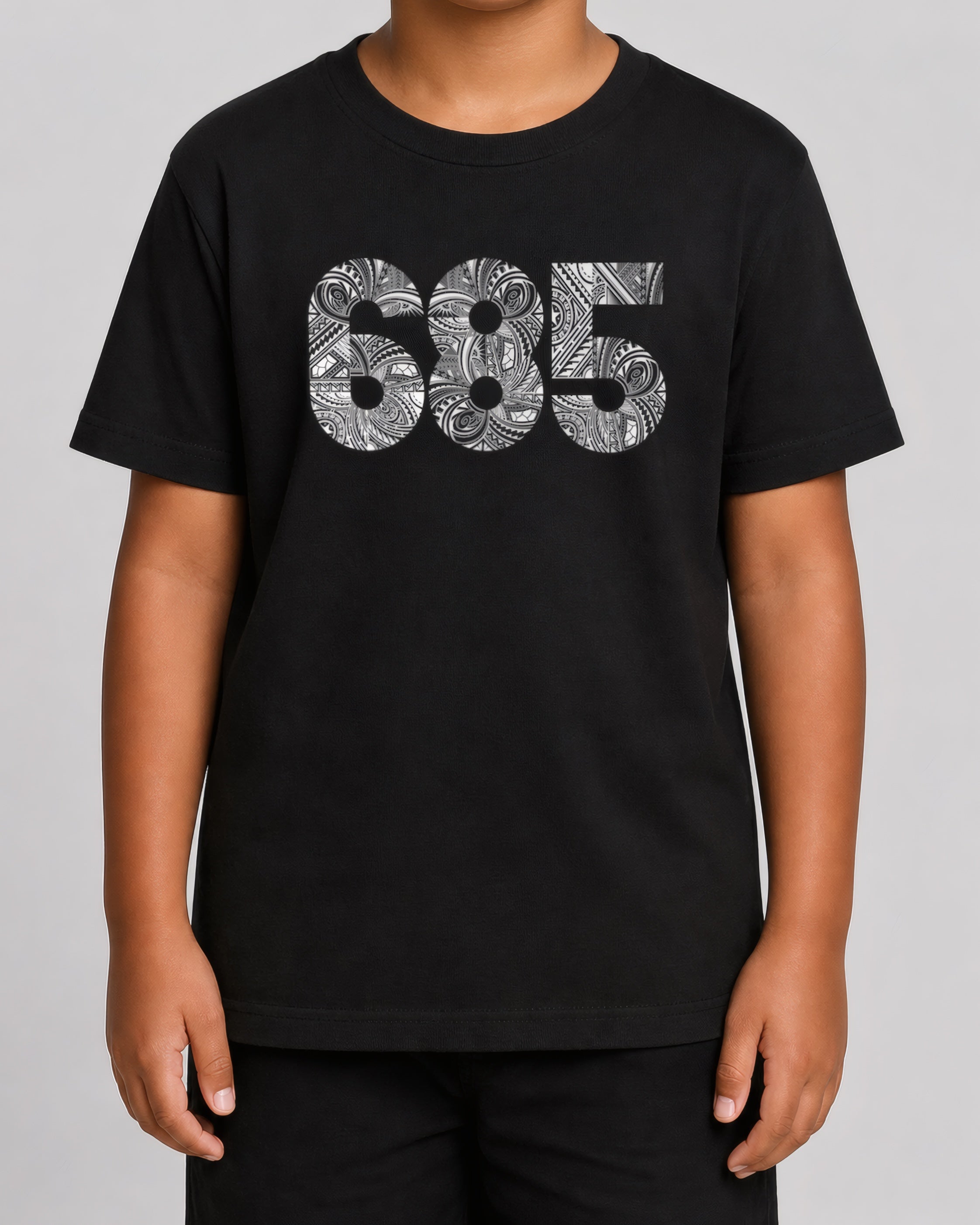 Kids Tee - 685 on a light grey studio background