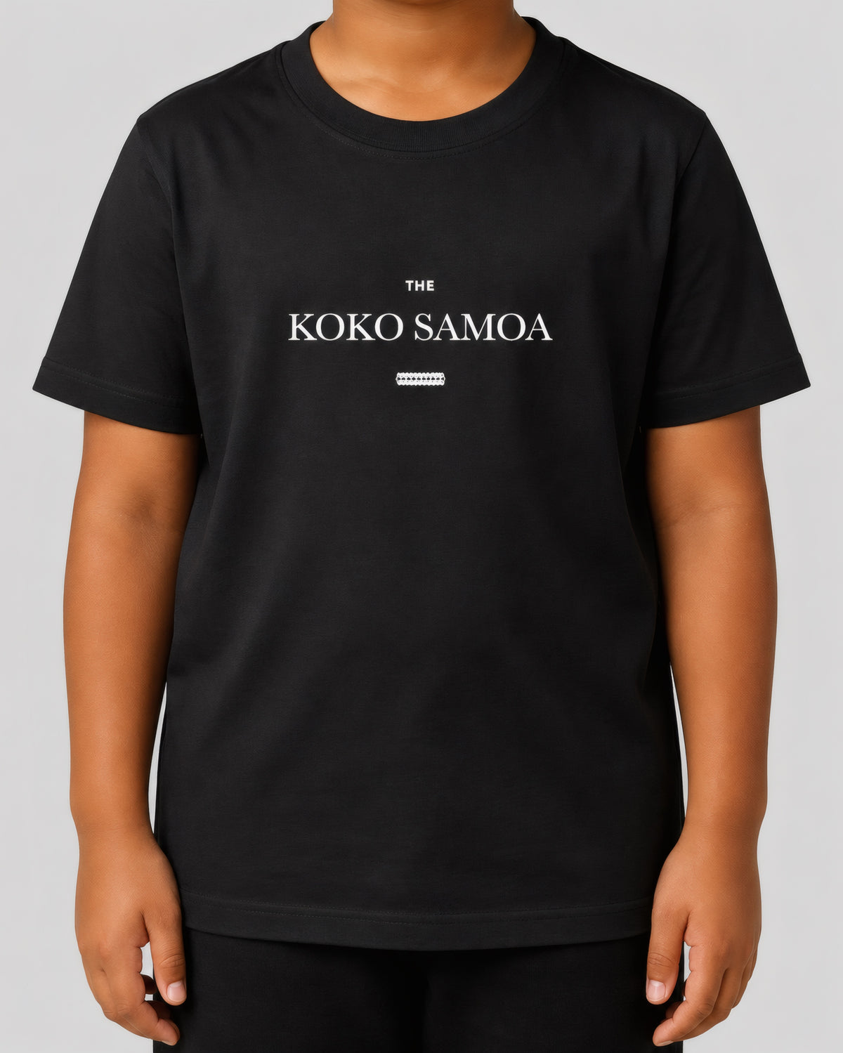 Kids Tee - The Brand Classic on a light grey studio background
