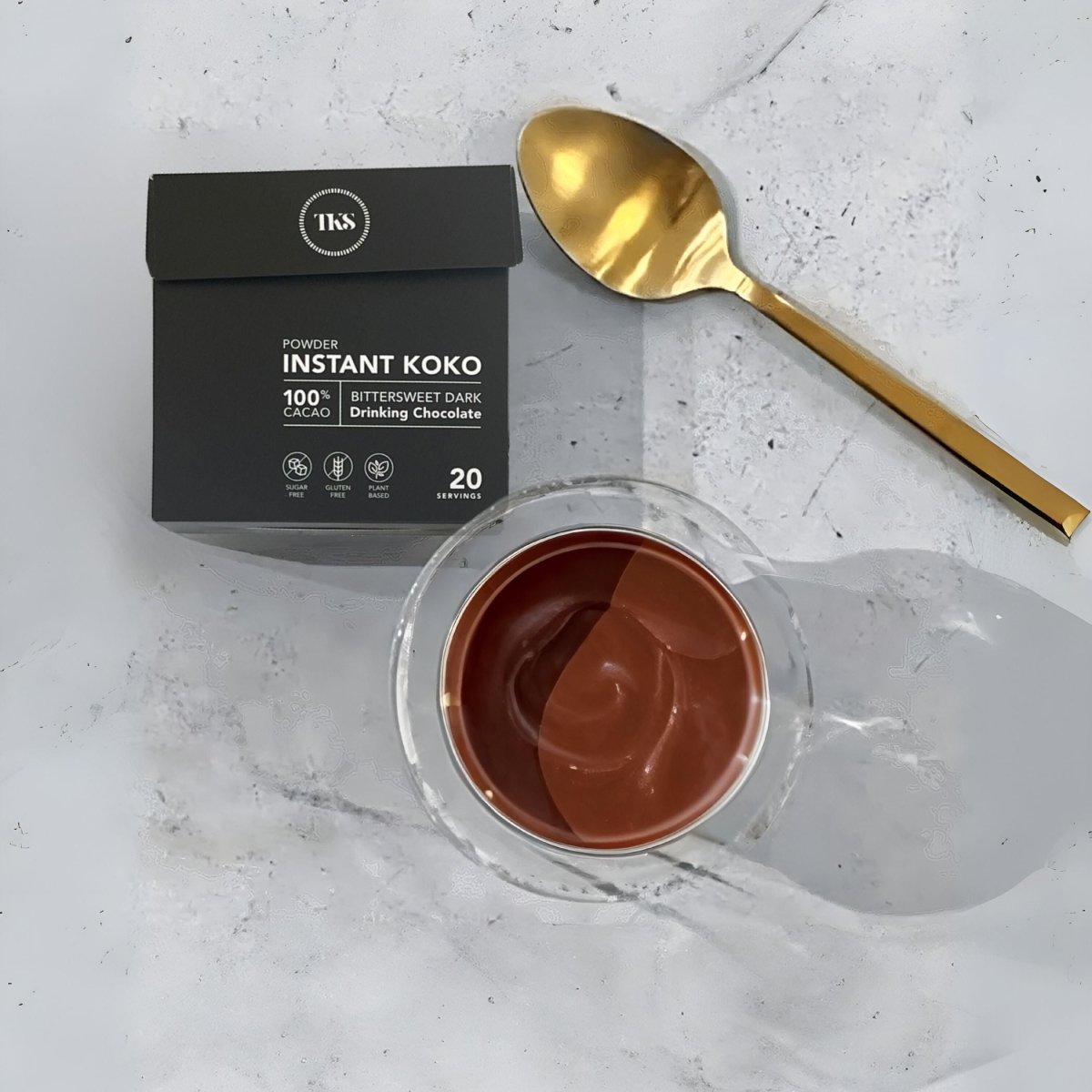 Instant Koko Samoa drinking chocolate by THE KOKO SAMOA, showing a rich, creamy cocoa beverage in a mug.