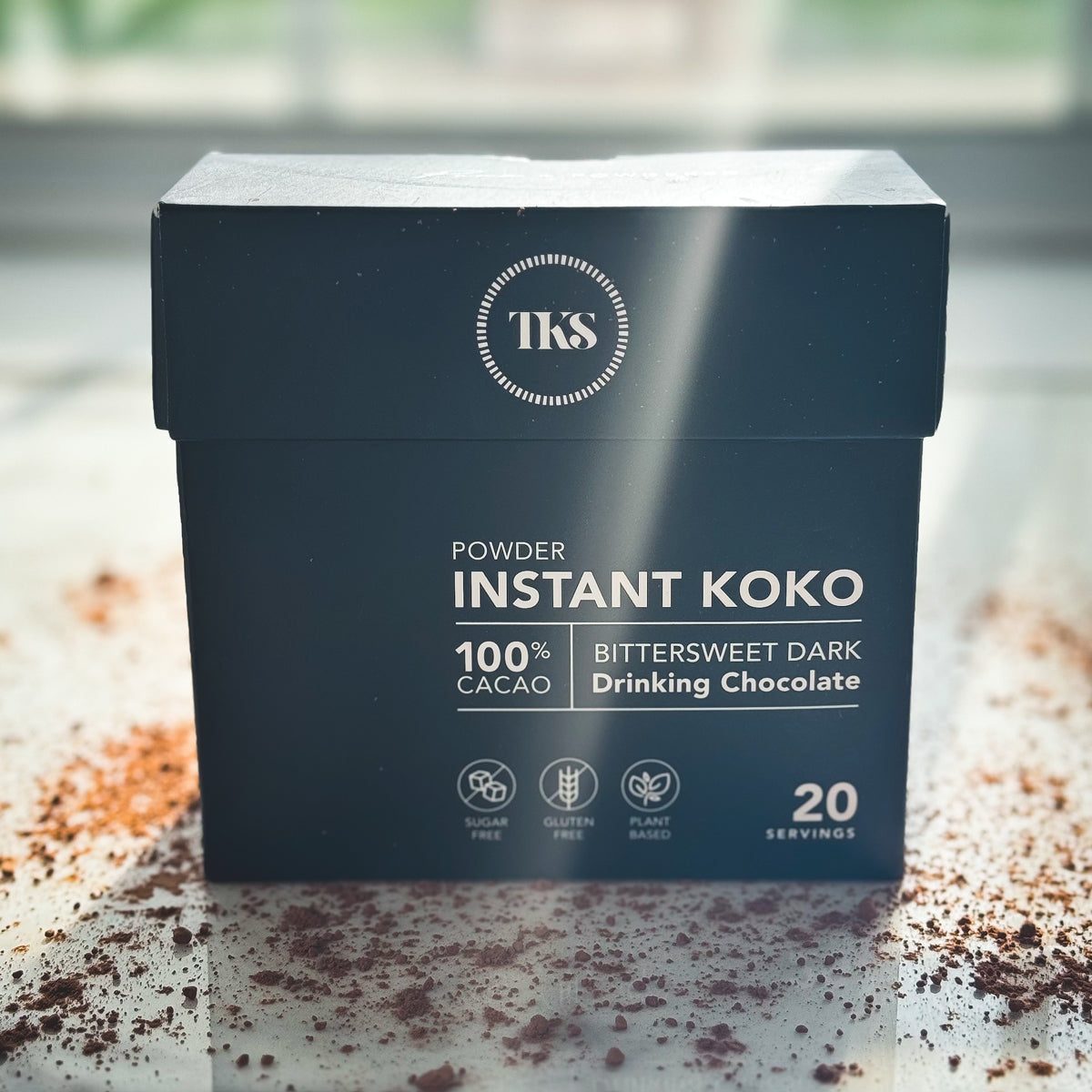 Instant Koko Samoa drinking chocolate by THE KOKO SAMOA, rich cocoa powder in a jar for hot chocolate preparation.
