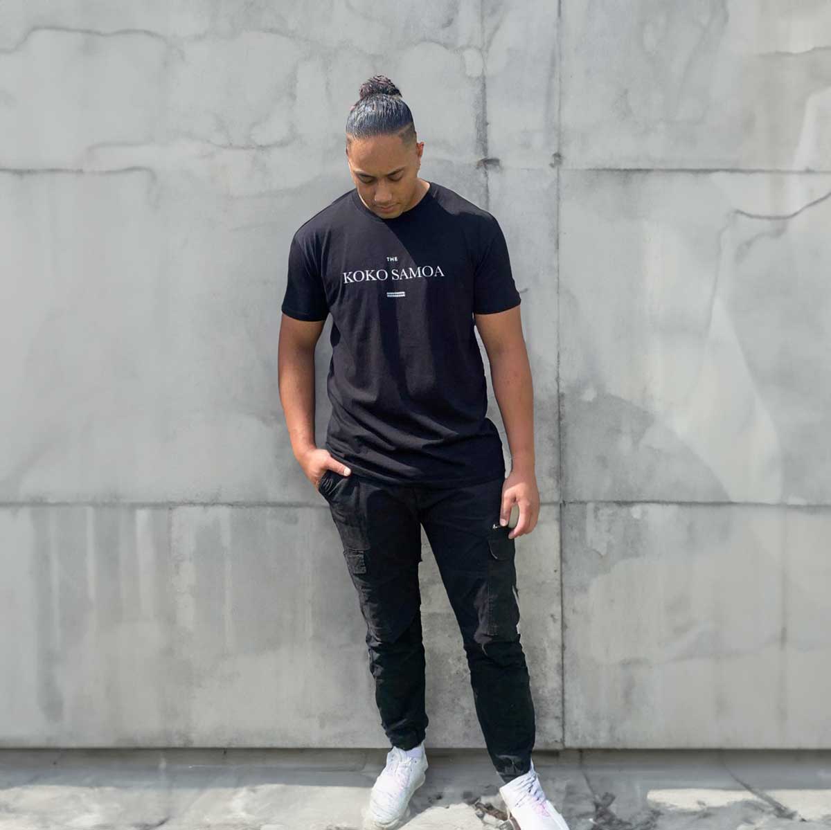 Black unisex heavy tee by Monster Digital, featuring The Brand Classic design, soft cotton fabric, ideal for casual wear.